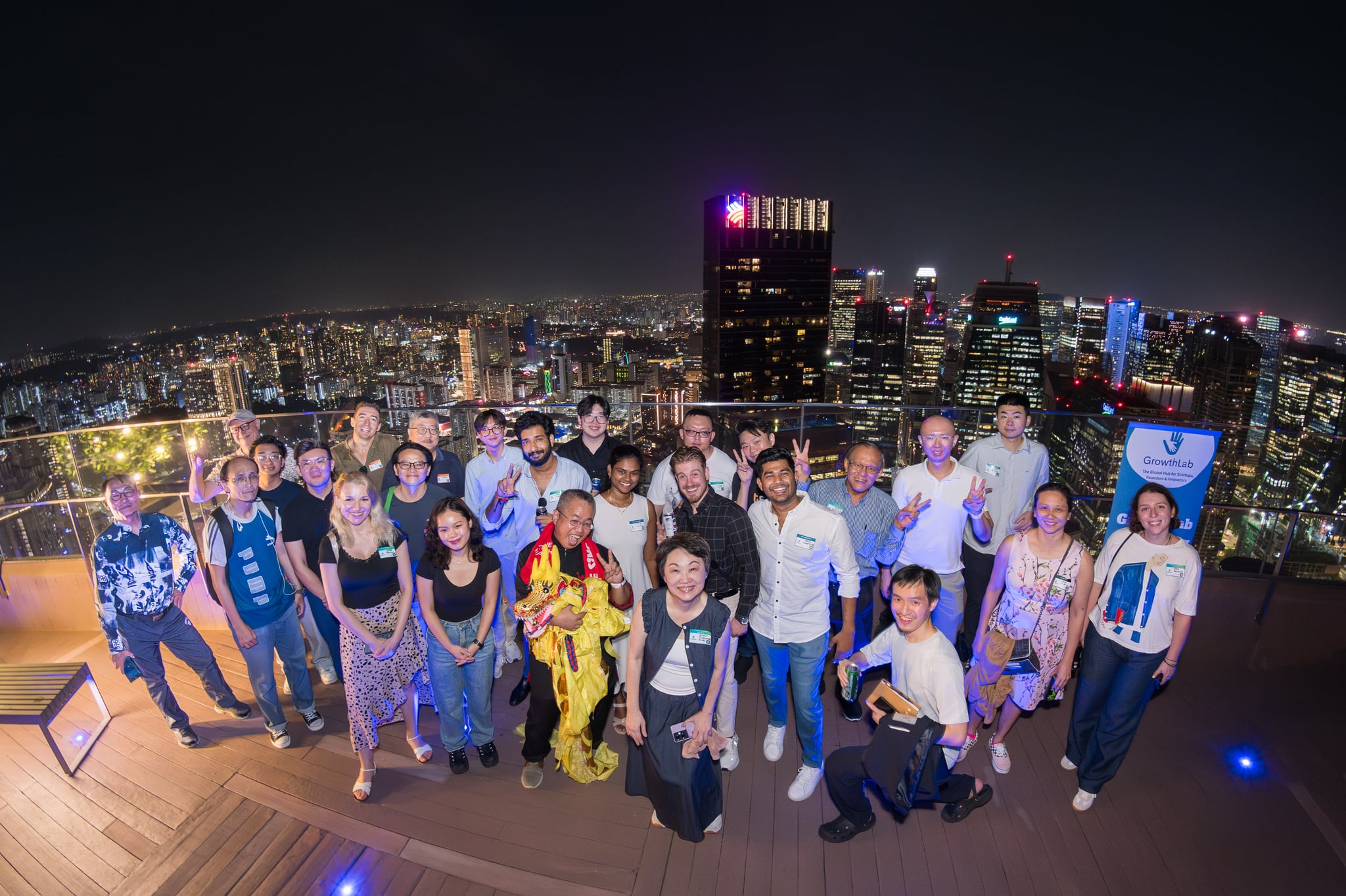 Founders networking at GrowthLab Rooftop Christmas Mixer in Singapore